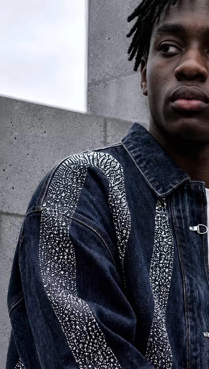 SHIFT — close-up of embellished denim jacket detail